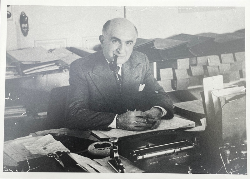 Lamberto Yonna at the desk
